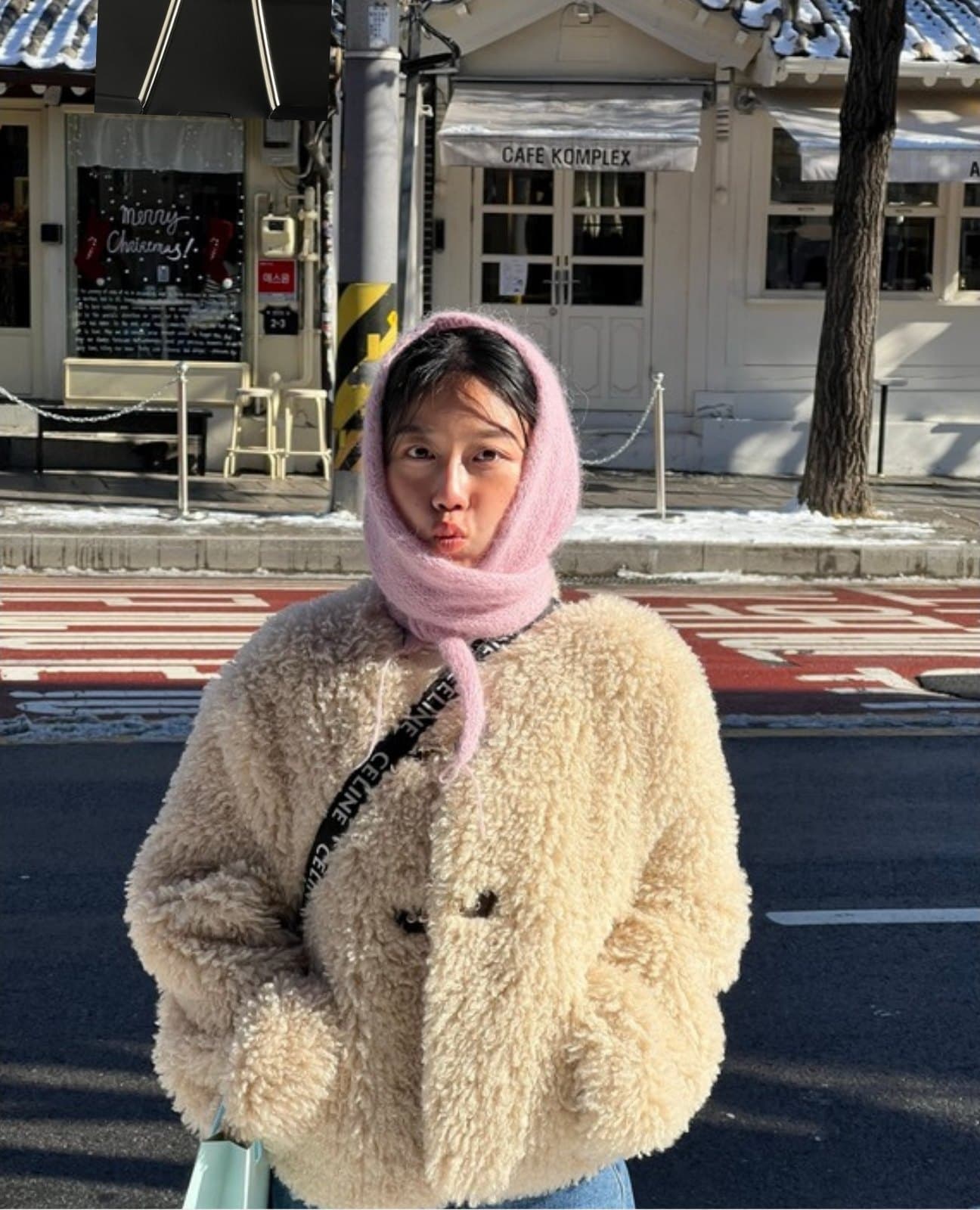 Dabin outdoors in winter, wearing a fleece coat and knitted hood