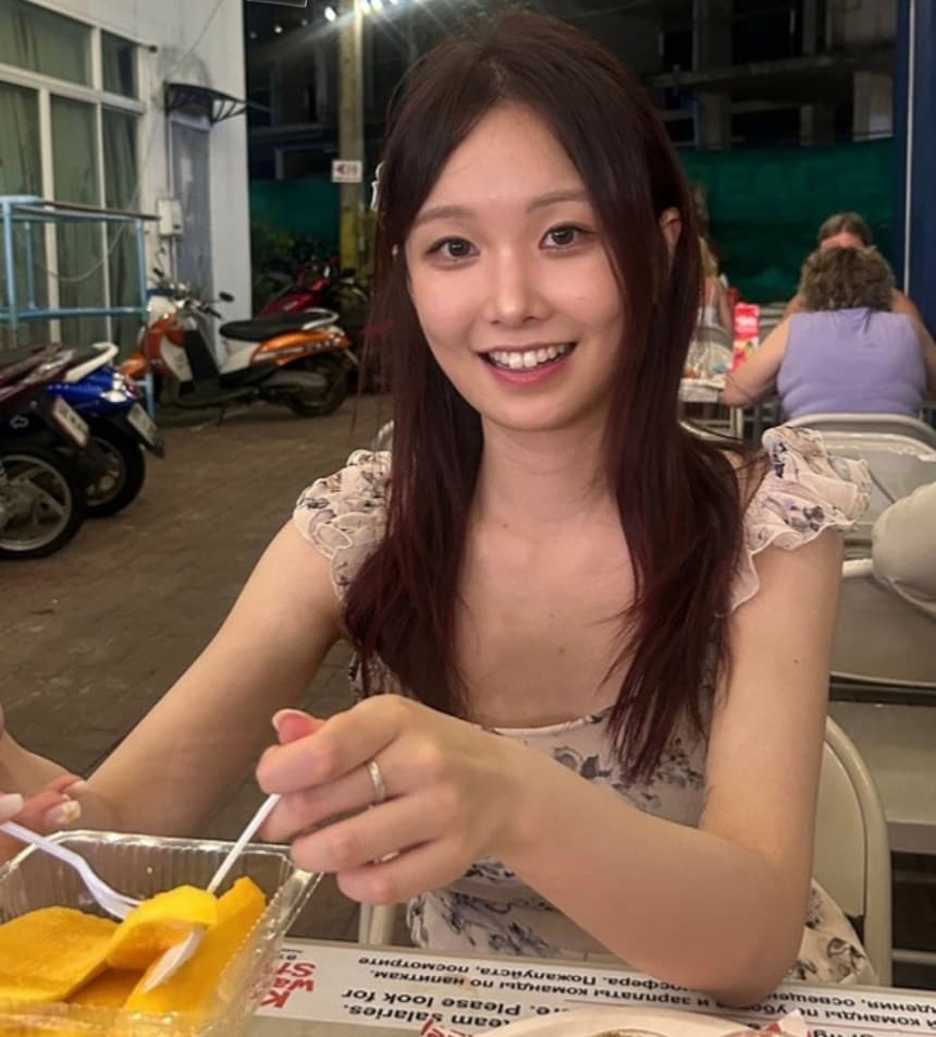 Jiyun at a night market table
