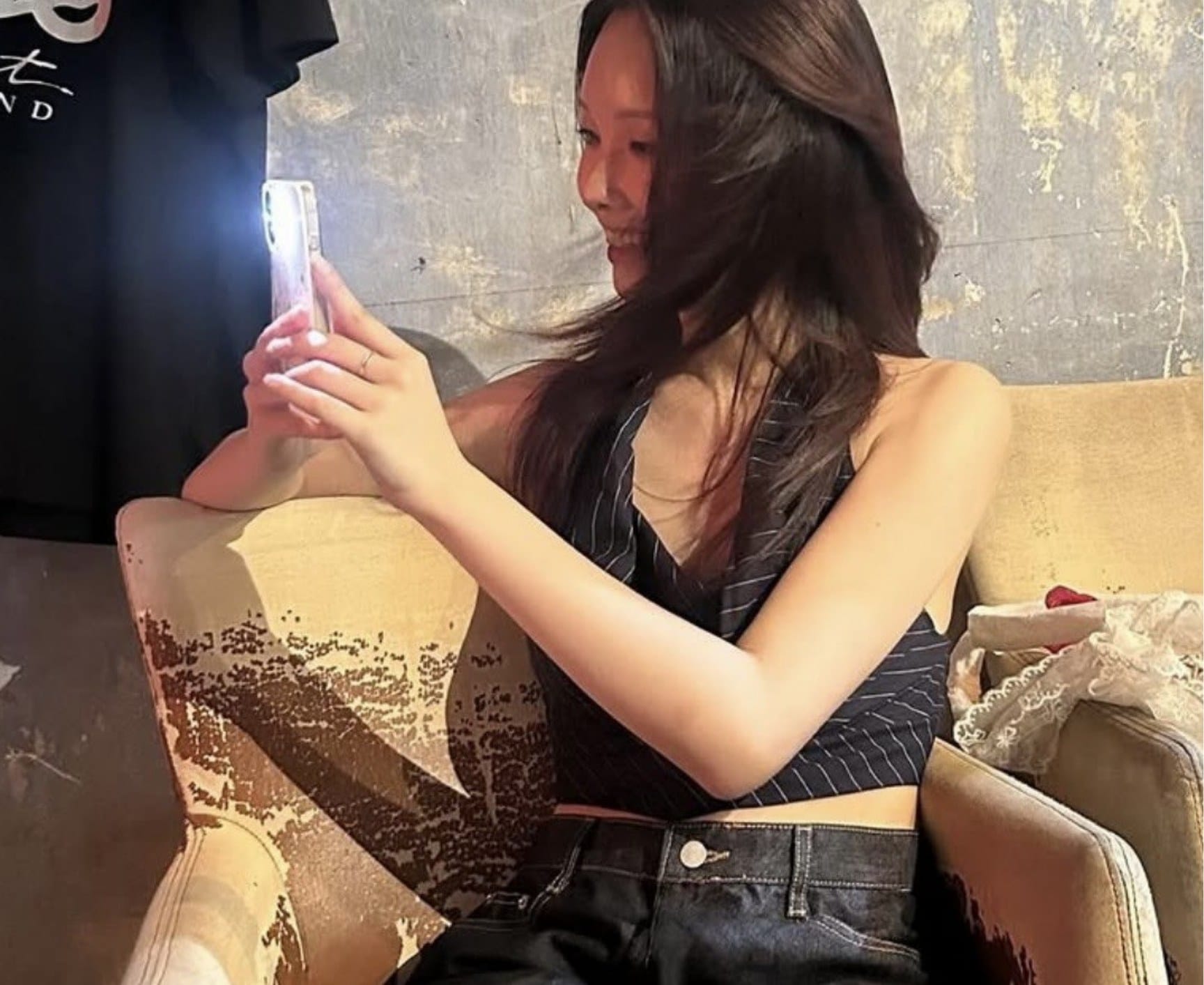 Jiyun checking her phone in a Seoul café