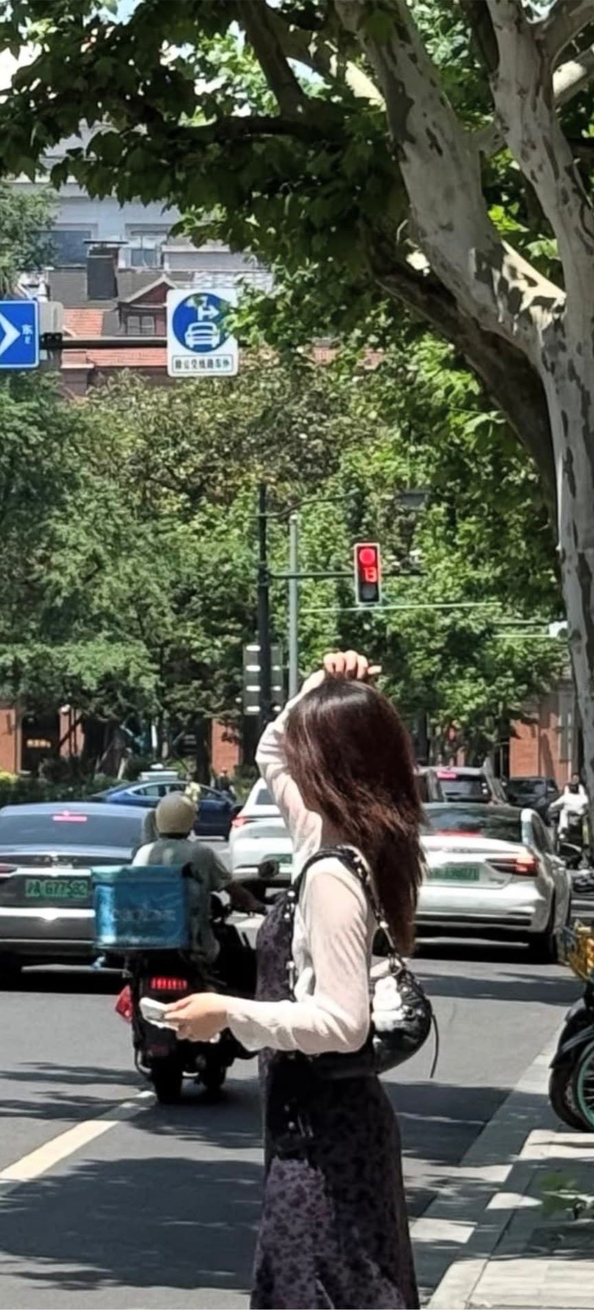 Jiyun walking a tree-lined Seoul street
